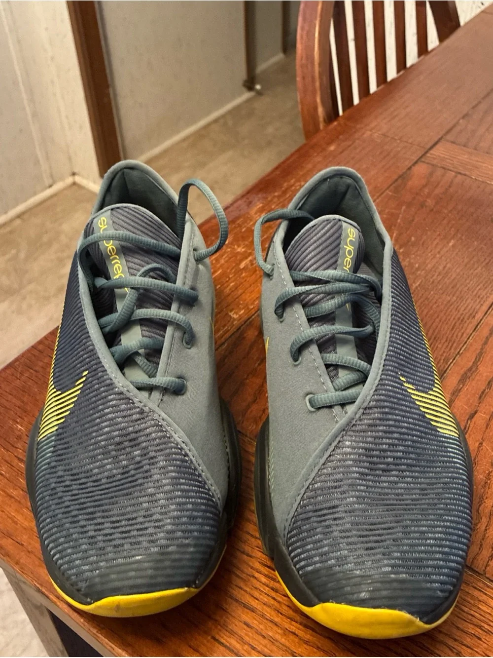 Nike Men’s Gray Athletic Shoes with Yellow Swoosh